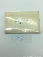 Photo of the back of the Hallmark card pack showing the brand and that there are 8 Christmas gift cards for 50 cents