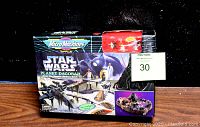Sealed retail box showing the entire Planet Dagobah playset with Star Wars branding and Micro Machines logo.