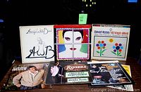 Photo showing a selection of albums including Average White Band, David Rose Strings Alive, Tony Bennett Greatest Hits double album, and others.