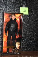 Front view of boxed Peeta doll by Barbie Collector Black Label, showing packaging and doll details.