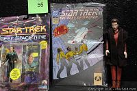 Photo showing sealed Star Trek Deep Space Nine Lieutenant Jadzia Dax action figure, bagged Star Trek TNG comic book, and loose action figures of two other Star Trek characters.