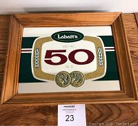 Front view of the Labatt 50 framed mirror showing the logo and frame details.