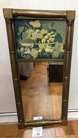 Full view of the vintage rectangular mirror showing the green fruit still life artwork on top and gold wooden frame