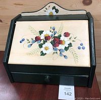 Front perspective of the wooden bread box showing the large handpainted berry and floral design on the lid.