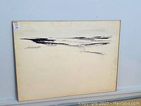 Overall front view of the oil painting on board against a white wall