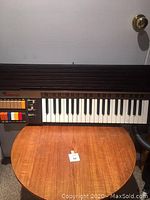 Front view of the vintage Bontempi keyboard showing the full set of keys and colorful control buttons.