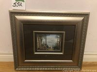 Framed overall view showing silver decorative frame and print size relative to frame.