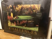 Full view of framed poster titled 'Challenges' showing golf course with autumn colors and motivational text on black frame.