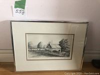 Framed etching artwork showing overall view including frame and mat.