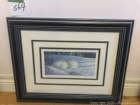 Full view of framed limited edition print showing the black frame, double matting, and winter scene of Rock Ptarmigan birds in snow.