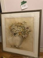 Framed floral still life artwork by Jeanine Pheland showing full view of painting in vase with flowers.