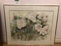 Front view of framed watercolor painting showing white roses and foliage.