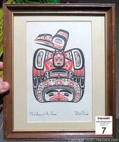 Full framed print showing the traditional Indigenous art in black and red colors within an aged wooden frame.