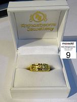 Ring presented in Richardson’s Jewellery branded box on white cushion