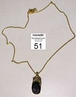 Full view of vintage gold-tone necklace with amethyst pendant and 20-inch chain.