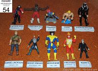 Full view of all 10 vintage action figures with name placards