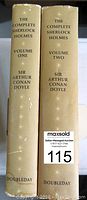 Spine view of both volumes showing titles, author, volume numbers, with publisher Doubleday at bottom. Volume one has some minor wear marks.