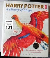 Front cover of the hardcover book featuring a colorful phoenix illustration and title text.