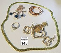 Photo showing full jewelry set: necklace, pendant, earrings, and ring.