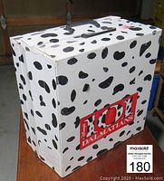 Closed dalmatian-spotted box featuring 101 Dalmatians graphics showing the packaging.