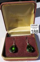 Earrings displayed in original box with cream lining and burgundy velvet insert.