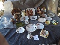 View of all glass and ceramic collectables including plates, vases, figurines and crystal basket.