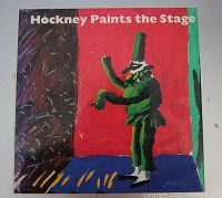Front cover of 'Hockney Paints the Stage' book showing colorful, abstract stage figure artwork.