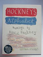 Front cover of Hockney's Alphabet book showing artistic lettering and dust jacket condition.