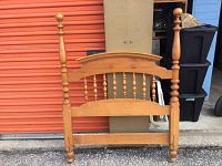Full view of the solid Roxton maple headboard showing turned posts, finials, and spindle detailing.