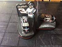 Pair of Dale Earnhardt bookends featuring Goodwrench #3 diecast cars and images of Dale Earnhardt.
