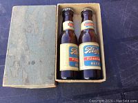 Pair of vintage Blatz beer bottle salt and pepper shakers in original worn cardboard box.