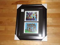 Full view of the two framed prints stacked vertically in a double frame, with protective corner covers.