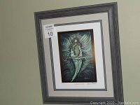 Full view of framed print showing the artwork, frame, and artist signature.