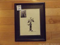 Framed original ink sketch titled 'Totems of Duncan B.C.' by Ron Blackwell shown fully framed on wood floor.