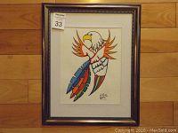 Framed acrylic painting featuring a colorful Indigenous eagle design by Keith Gattie.