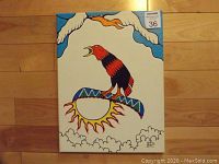 Painting view with bird perched on sun symbol, tree branches above, and cloud details, showing the colorful, stylized design and composition.