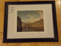 Photo showing entire framed print on floor with auction lot number sticker visible.