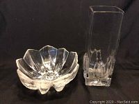 Set showing both candy bowl and tall rectangular vase with embedded fruit design on black background.