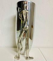 Full front view showing vase and integrated figure