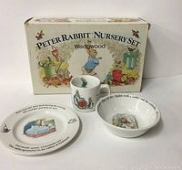 Full set with original box showing all three items: plate, bowl, and mug with Peter Rabbit illustrations and text.
