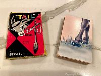 Original Tail the Donkey game box with donkey illustration and stacked deck of cards showing donkey feet on top