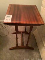Full view of wood side table showing rectangular top and base with turned legs.