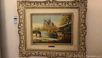 Full view of framed painting showing entire scene and frame