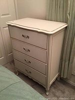 Front side view of full chest showing overall shape and drawer configuration