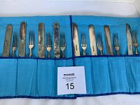 Full view of 8 fish forks and 8 fish knives inside blue flannel storage case showing the entire set.