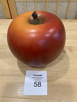 Front and top quarter view of the apple showing coloration and stem