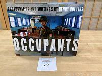 Front cover of 'Occupants' book by Henry Rollins showing a soldier in uniform indoors.