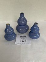 Front view of three blue ceramic gourd-shaped miniature vases in varying sizes, arranged with auction tag showing dimensions.