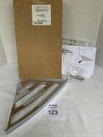 Product photo showing the shelf, screws, instructions, and original box labeled Essentials Firenze FI176 Shower corner CR, made in Italy.