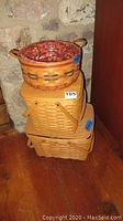 Stack of three Longaberger baskets showing various sizes and styles.